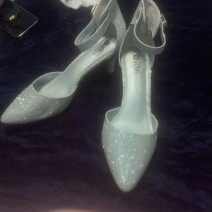 Silver sparkles heels.
